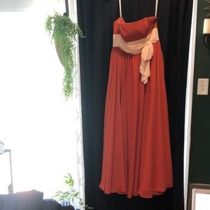 Orange dress with a cream bow